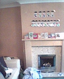 Some home-made decorations above the fire and a mysterious pair of les on the sofa. Marvellous.