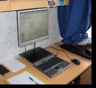 Laptop connected to wallmounted TFT monitor, almost looks like I know what I'm doing...